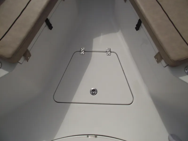 Slide: The Image of 2019 Sportsman Open 232 Center Console boat interior with storage compartment. - 15