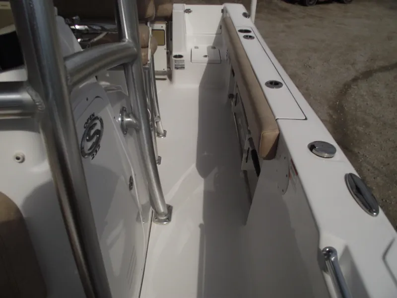 Slide: The Image of 2019 Sportsman Open 232 Center Console boat interior with seating and rod holders. - 18