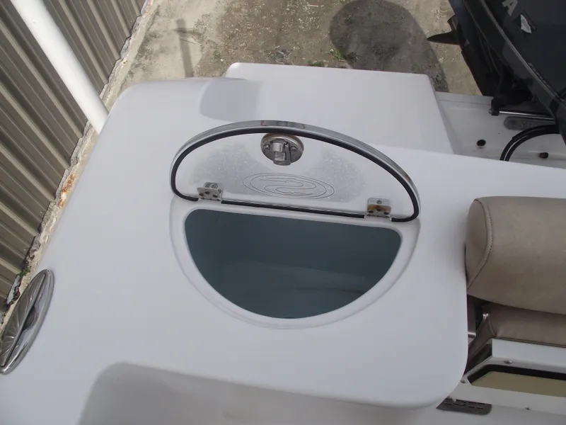 Slide: The Image of 2019 Sportsman Open 232 Center Console livewell with open lid, showcasing interior. - 33