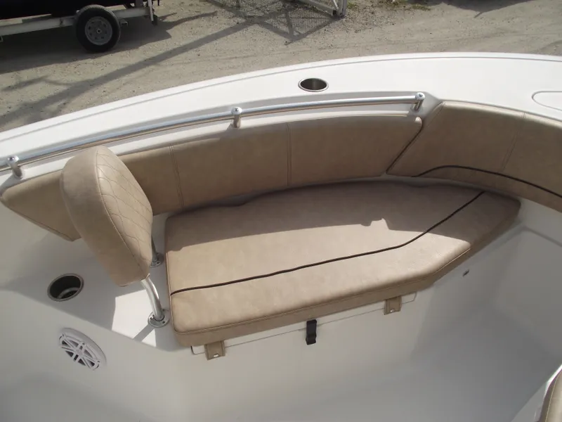 Slide: The Image of 2019 Sportsman Open 232 Center Console boat with tan cushioned seating. - 7