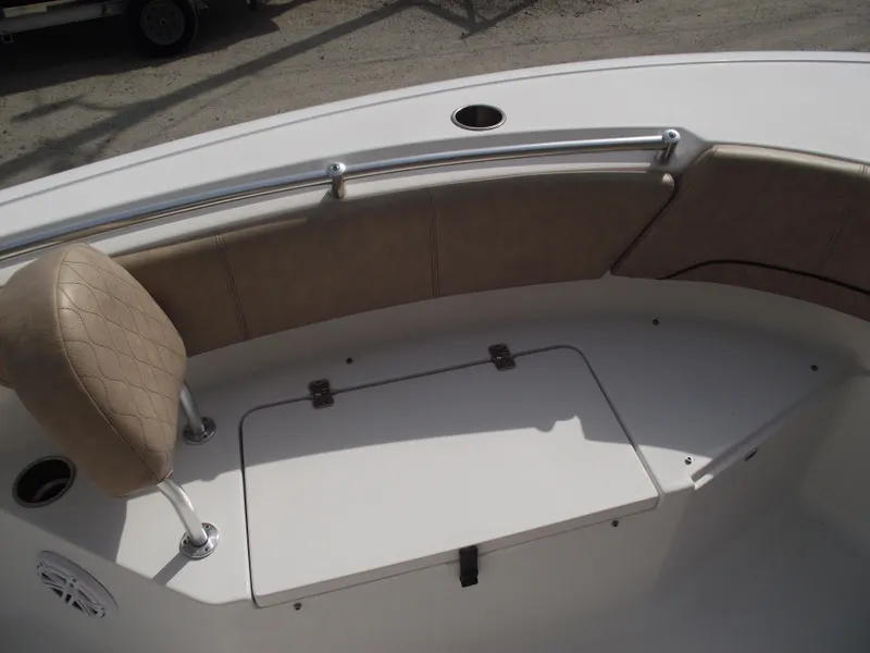 Slide: The Image of 2019 Sportsman Open 232 Center Console boat seating area with storage compartment. - 8