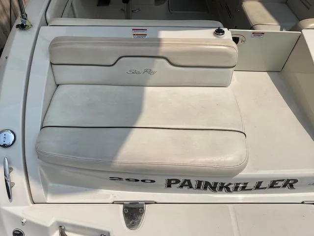 Slide: The Image of 2008 Sea Ray 290 Sundeck boat with white seating and "Painkiller" name. - 15