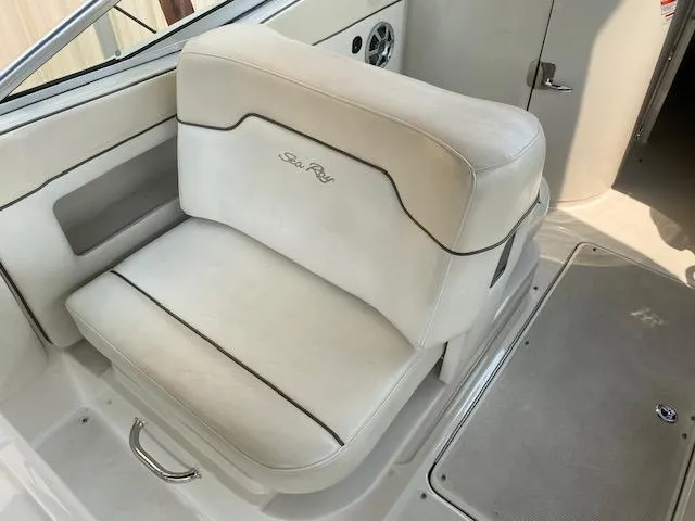 Slide: The Image of 2008 Sea Ray 290 Sundeck boat seat, white upholstery, interior view. - 22