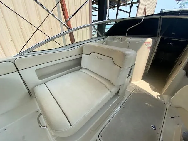 Slide: The Image of 2008 Sea Ray 290 Sundeck interior with white seating and sleek design. - 23