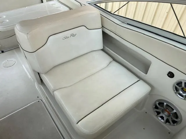 Slide: The Image of 2008 Sea Ray 290 Sundeck boat seat with white upholstery and speaker. - 25