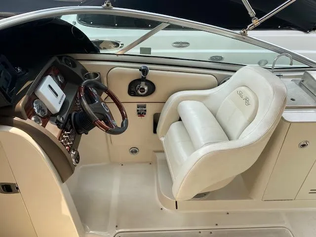 Slide: The Image of 2008 Sea Ray 290 Sundeck helm with steering wheel and comfortable captain's chair. - 28