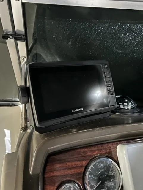 Slide: The Image of Garmin GPS on 2008 Sea Ray 290 Sundeck dashboard with wood paneling. - 30