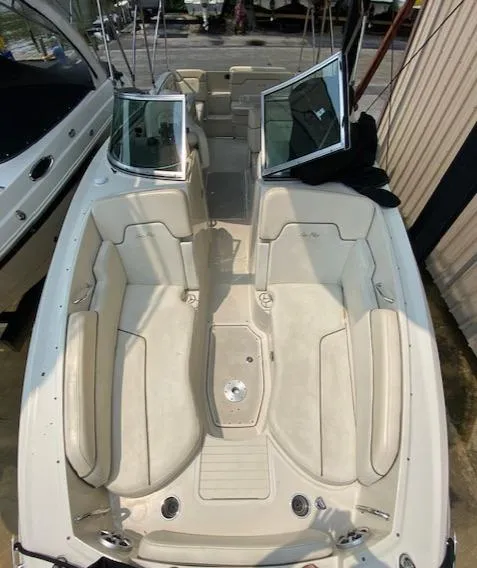 Slide: The Image of 2008 Sea Ray 290 Sundeck boat interior with open seating and windshield. - 33