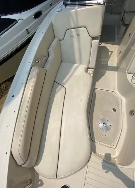 Slide: The Image of 2008 Sea Ray 290 Sundeck boat interior with beige seating and clean deck. - 34