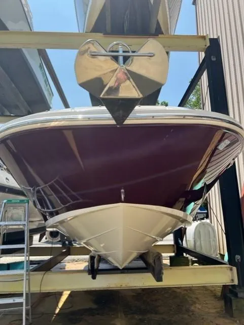 Slide: The Image of 2008 Sea Ray 290 Sundeck boat on a storage rack, viewed from the front. - 4