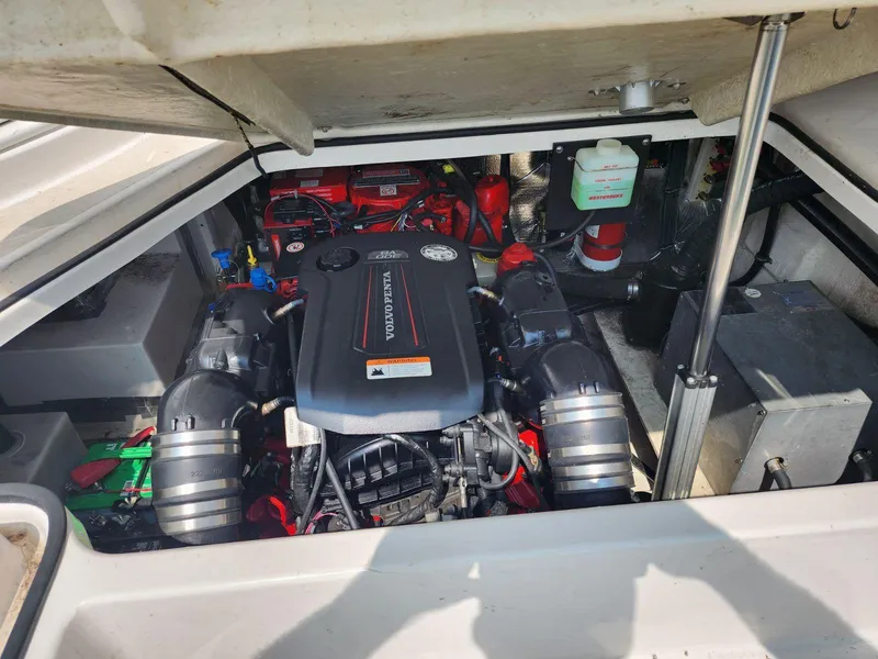 Slide: The Image of Engine compartment of a 2008 Sea Ray 290 Sundeck boat, showcasing the engine and components. - 45