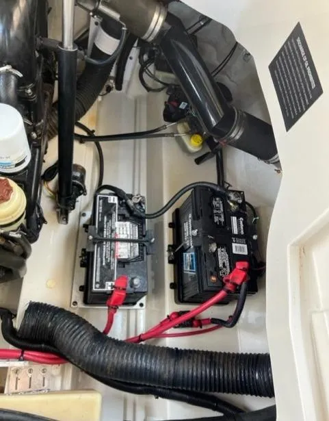 Slide: The Image of 2008 Sea Ray 290 Sundeck engine compartment with dual batteries and wiring. - 49