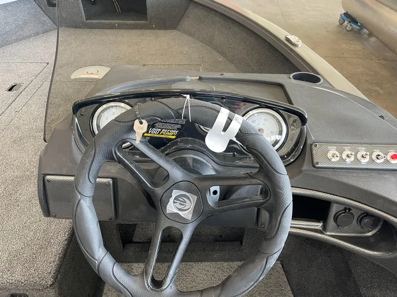 Slide: The Image of 2025 Crestliner 1750 Hawk boat dashboard with steering wheel and instrument panel. - 13