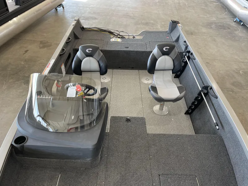 Slide: The Image of 2025 Crestliner 1750 Hawk boat interior with dual seats and steering console. - 18