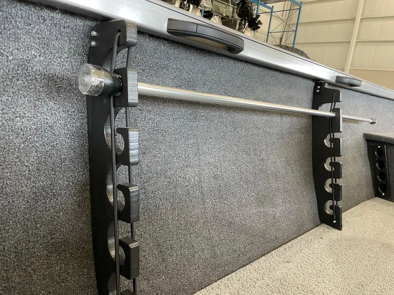 Slide: The Image of Crestliner 1750 Hawk 2025 boat interior with rod holder and textured surface. - 20