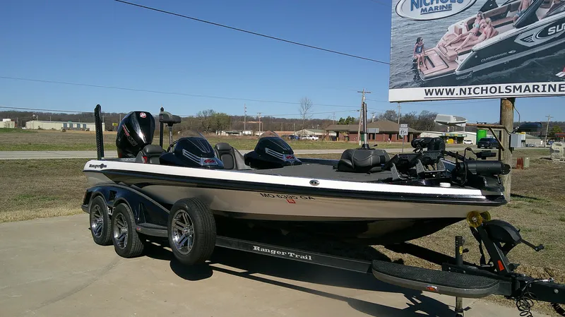 Slide: The Image of 2020 Ranger Z 521C boat on trailer, parked outdoors near Nichols Marine sign. - 3