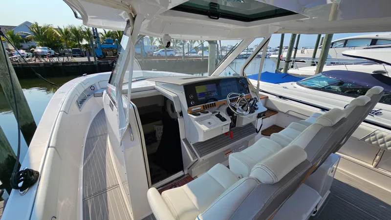 Slide: The Image of 2021 Regal 38 SAV boat interior with modern helm and seating. - 12