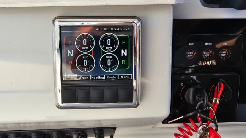 Slide: The Image of Control panel of 2021 Regal 38 SAV boat with digital display and Yamaha controls. - 16
