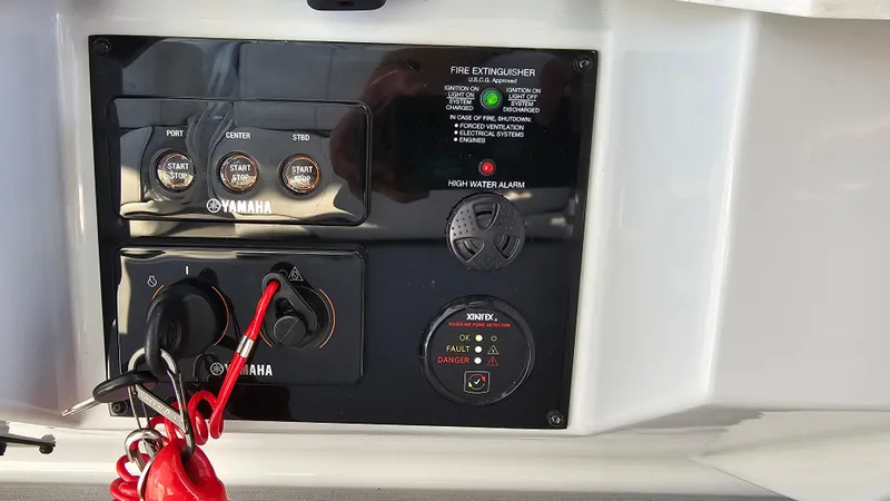 Slide: The Image of Control panel of a 2021 Regal 38 SAV boat with Yamaha ignition switches. - 17