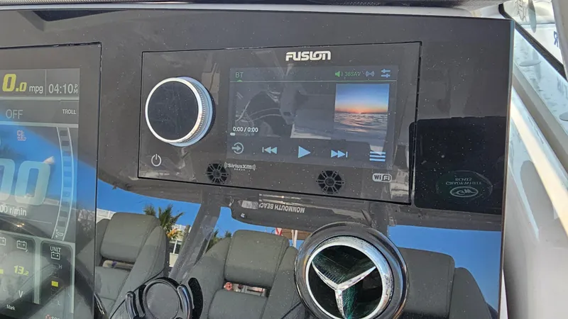 Slide: The Image of Control panel of a 2021 Regal 38 SAV boat with Fusion audio system. - 22