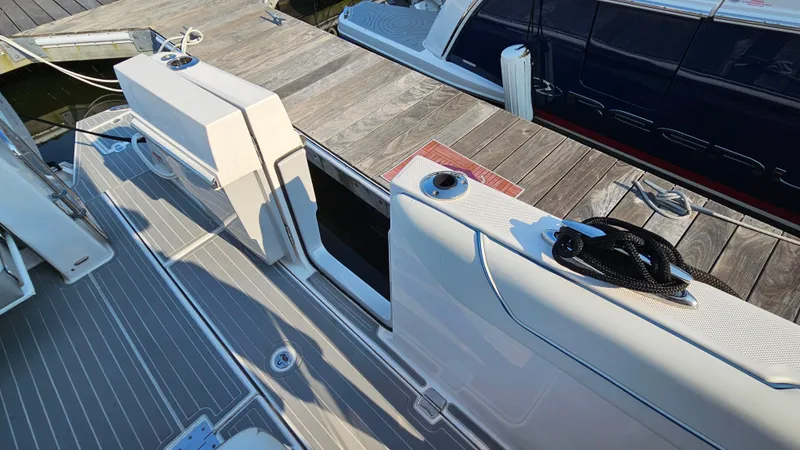 Slide: The Image of 2021 Regal 38 SAV yacht docked, showcasing sleek deck design and modern features. - 40