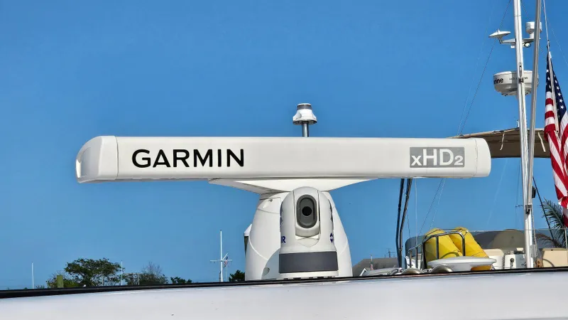 Slide: The Image of Garmin xHD2 radar on 2021 Regal 38 SAV boat against clear blue sky. - 8