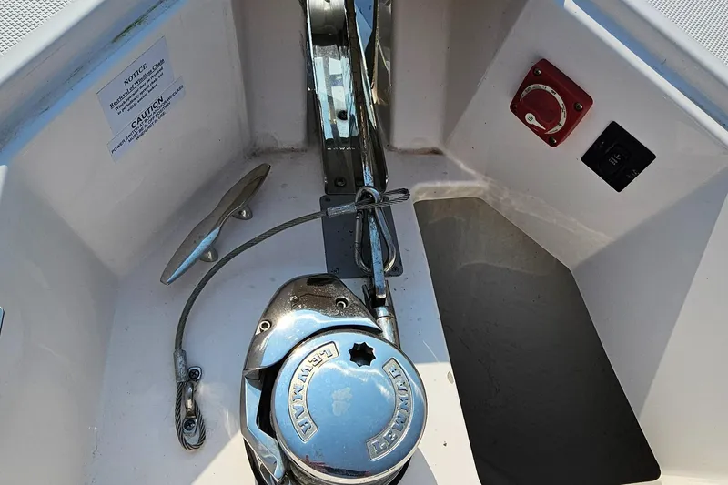 Slide: The Image of Anchor system on 2021 Regal 38 SAV boat deck, featuring winch and cleat. - 9