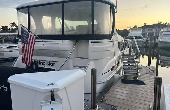 Slide: The Image of 2003 Sea Ray 390 Motor Yacht docked at marina during sunset. - 10