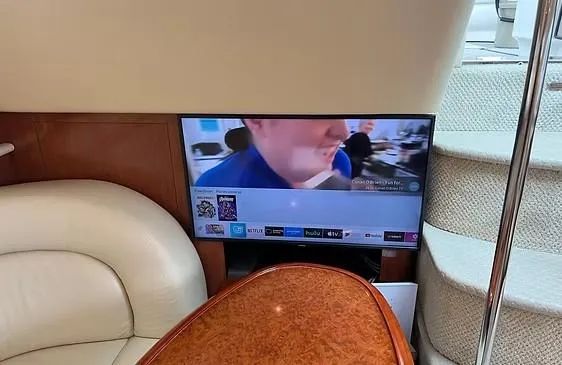 Slide: The Image of Interior of 2003 Sea Ray 390 Motor Yacht with TV and seating area. - 11