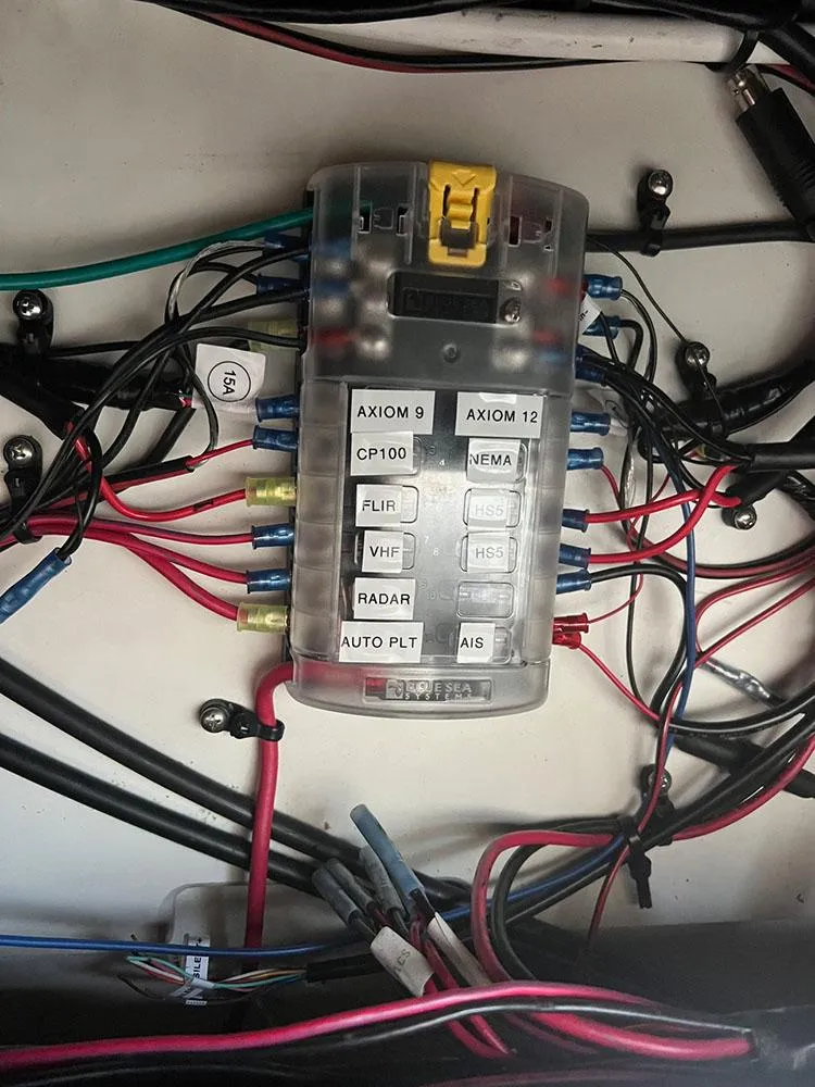 Slide: The Image of Electrical panel of a 2003 Sea Ray 390 Motor Yacht with labeled wiring connections. - 21