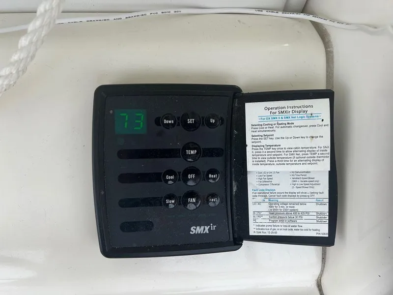 Slide: The Image of SMXir control panel on 2003 Sea Ray 390 Motor Yacht, displaying temperature settings. - 26