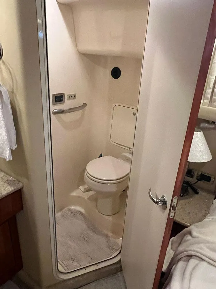 Slide: The Image of 2003 Sea Ray 390 Motor Yacht bathroom interior with compact design and modern amenities. - 32