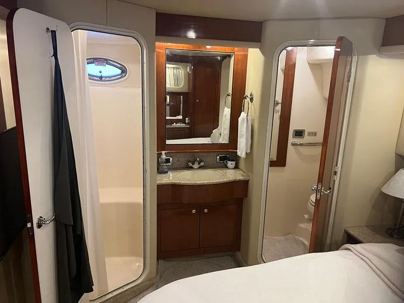 Slide: The Image of Interior of 2003 Sea Ray 390 Motor Yacht with bathroom and vanity area. - 33