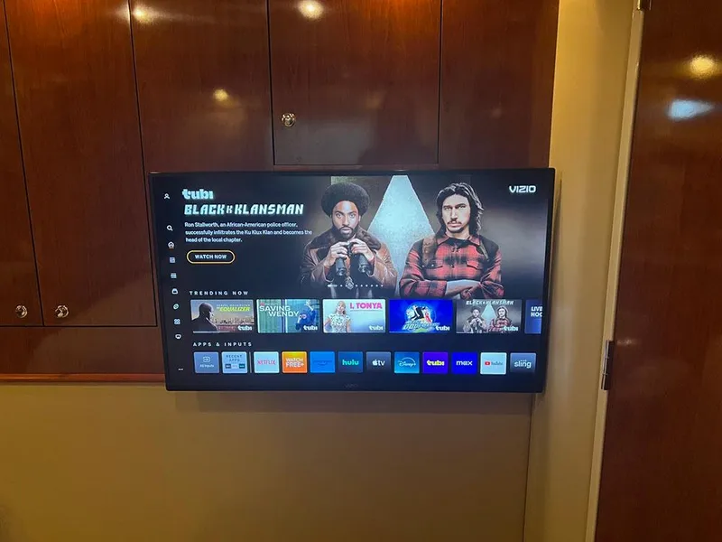 Slide: The Image of Wall-mounted Vizio TV displaying streaming apps inside a 2003 Sea Ray 390 Motor Yacht. - 34