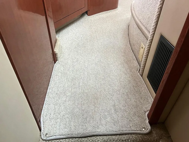 Slide: The Image of Carpeted interior hallway of a 2003 Sea Ray 390 Motor Yacht. - 35