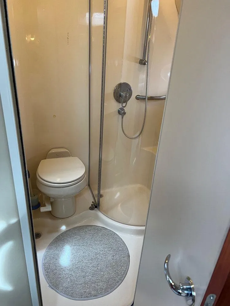Slide: The Image of Bathroom interior of 2003 Sea Ray 390 Motor Yacht with shower and toilet. - 36