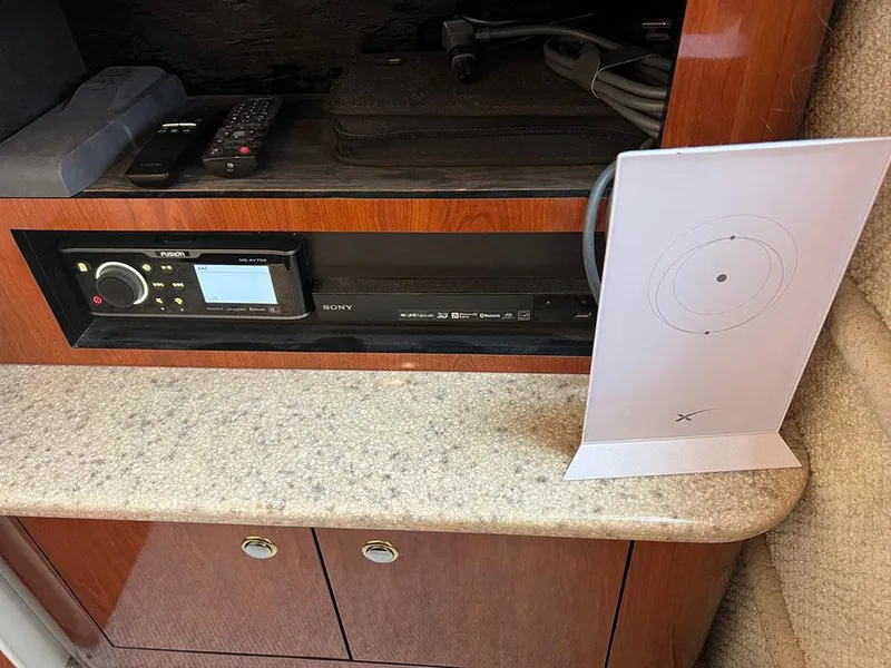 Slide: The Image of 2003 Sea Ray 390 Motor Yacht interior with audio system and modern device. - 38