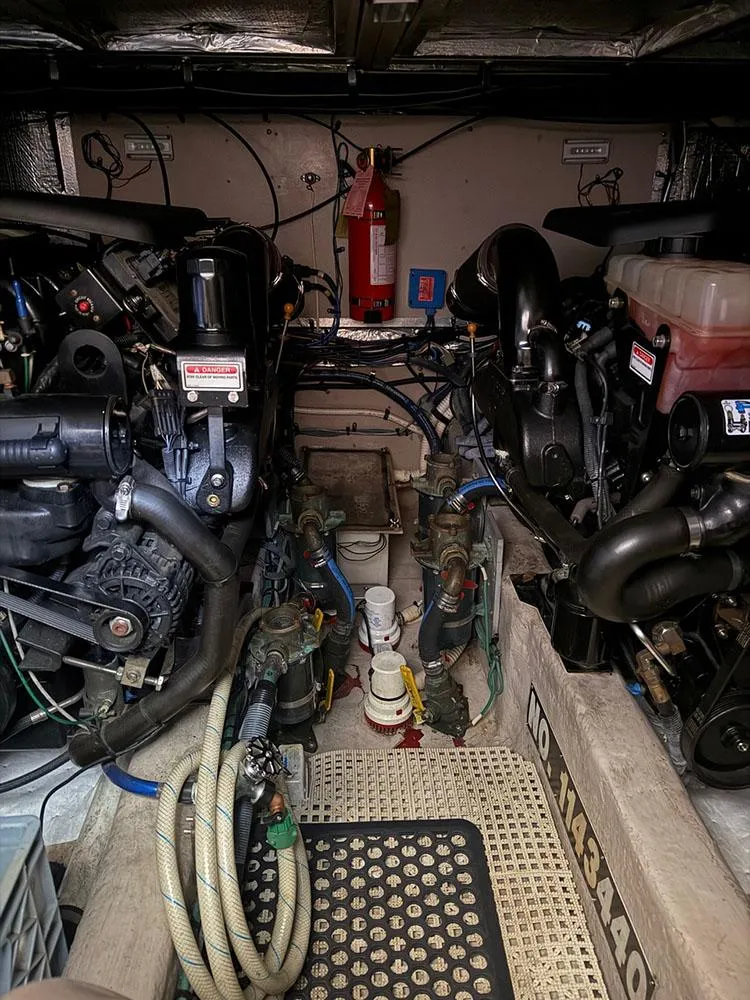 Slide: The Image of Engine room of a 2003 Sea Ray 390 Motor Yacht, showcasing dual engines and equipment. - 49