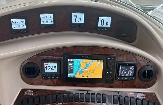 Slide: The Image of Dashboard of 2003 Sea Ray 390 Motor Yacht with navigation and control displays. - 9
