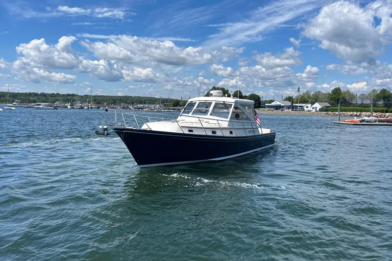 Slide: The Image of 2002 Little Harbor WhisperJet boat on a sunny day in a scenic harbor. - 14