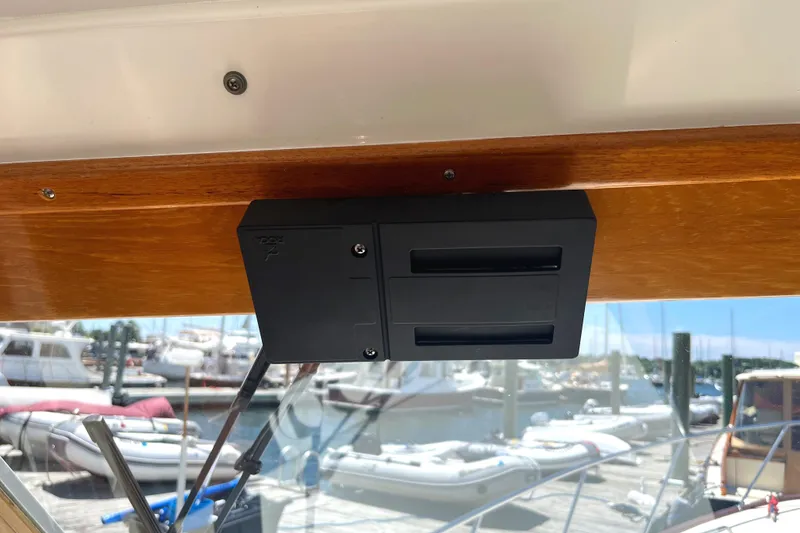 Slide: The Image of Control panel on 2002 Little Harbor WhisperJet boat, docked with other vessels in background. - 37