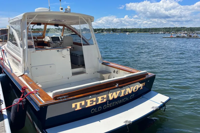 Slide: The Image of Little Harbor WhisperJet 2002 boat docked, named "Tee Winot," in Old Greenwich, CT. - 4