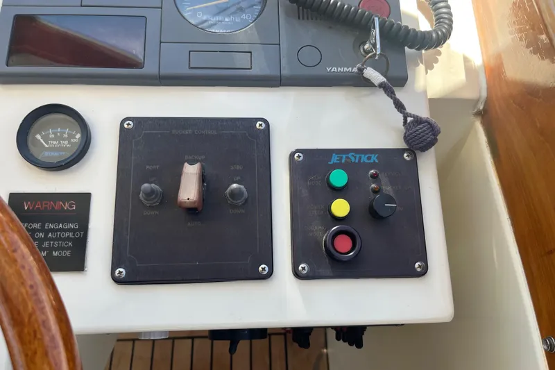 Slide: The Image of Control panel of a 2002 Little Harbor WhisperJet boat with JetStick system. - 42