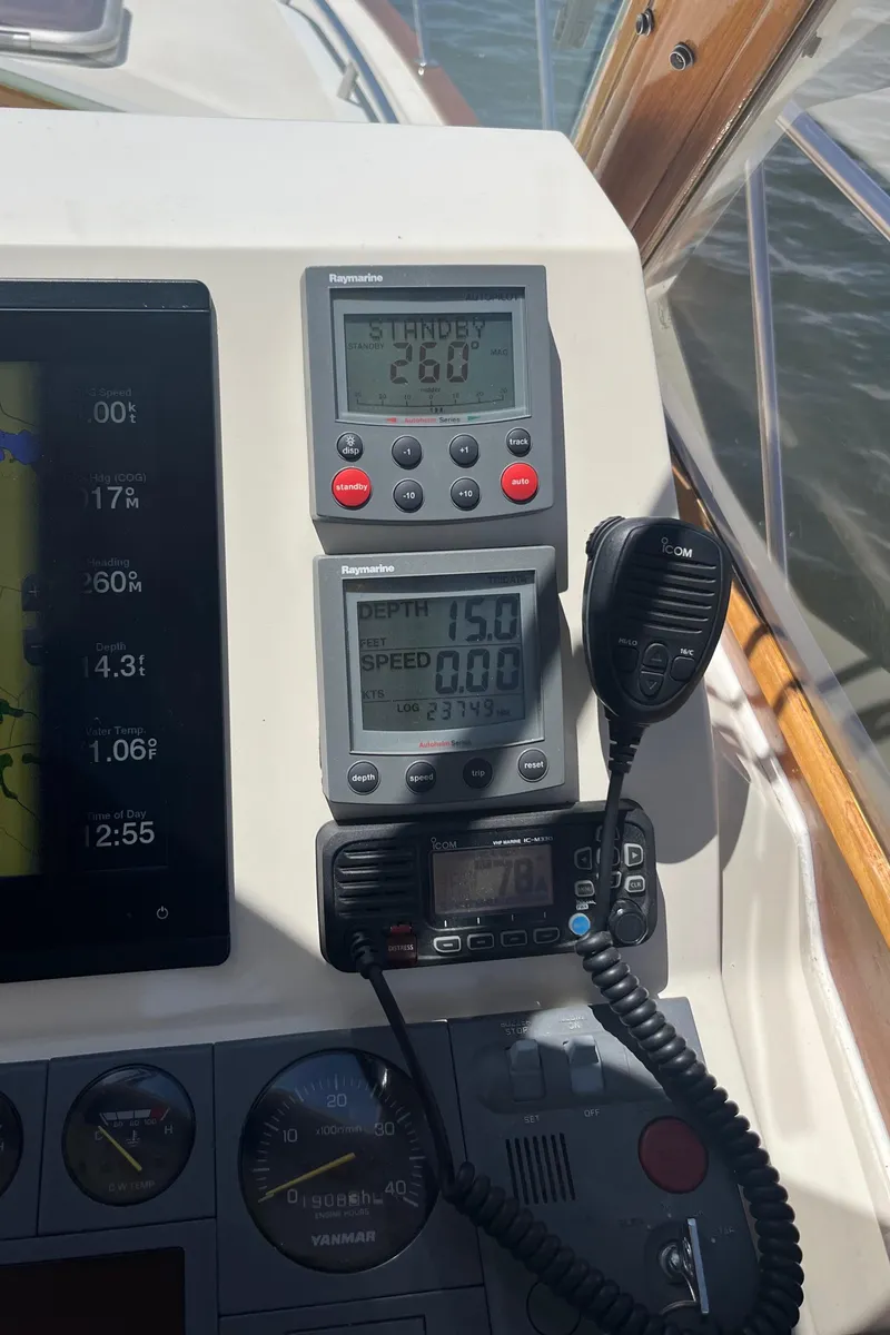 Slide: The Image of Control panel of a 2002 Little Harbor WhisperJet boat with navigation instruments. - 44