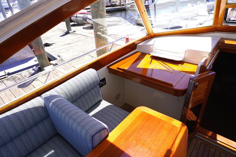 Slide: The Image of Interior of 2002 Little Harbor WhisperJet boat with wooden finish and striped seating. - 45