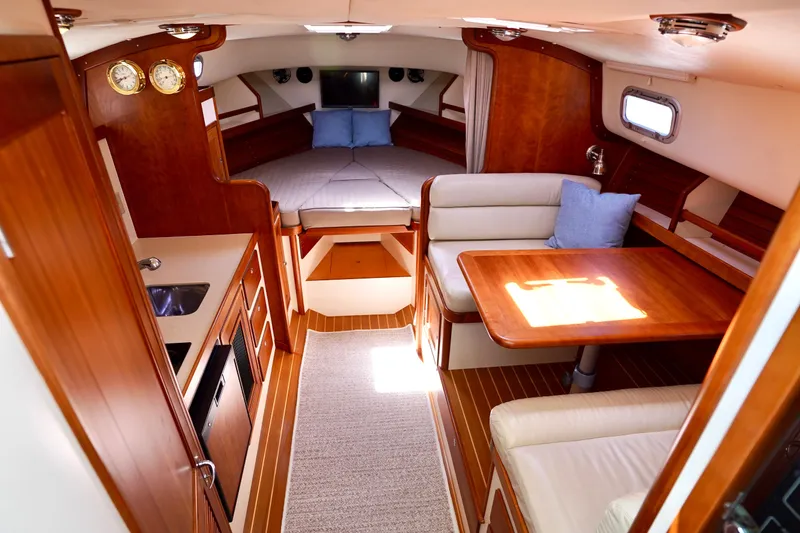 Slide: The Image of Interior of 2002 Little Harbor WhisperJet yacht with cozy seating and wooden finishes. - 9