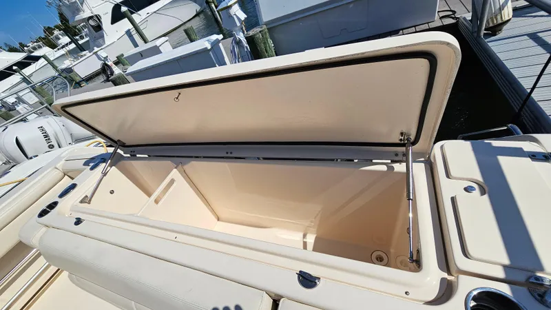 Slide: The Image of Open storage compartment on a 2016 Grady-White Express 330 boat. - 18