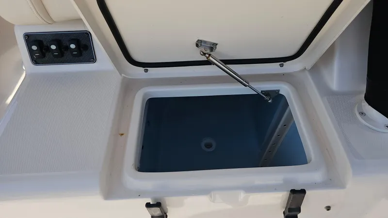 Slide: The Image of Open storage compartment on 2016 Grady-White Express 330 boat. - 24
