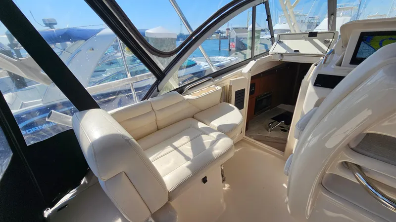 Slide: The Image of 2016 Grady-White Express 330 boat interior with plush seating and helm. - 25