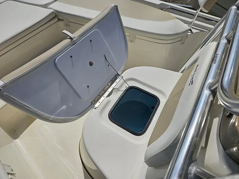 Slide: The Image of Bulls Bay 2200 XS 2025 boat interior with open storage compartment and seating. - 18
